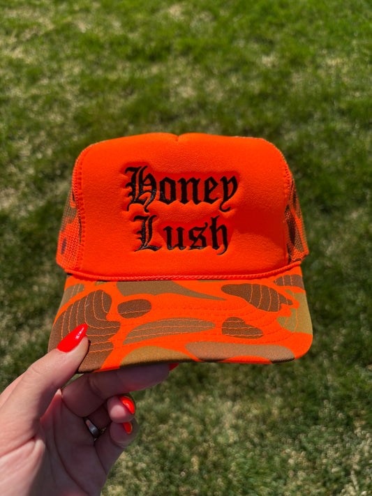 Honey Lush Embroidered Foam Front Trucker Hat: Neon Orange Camo